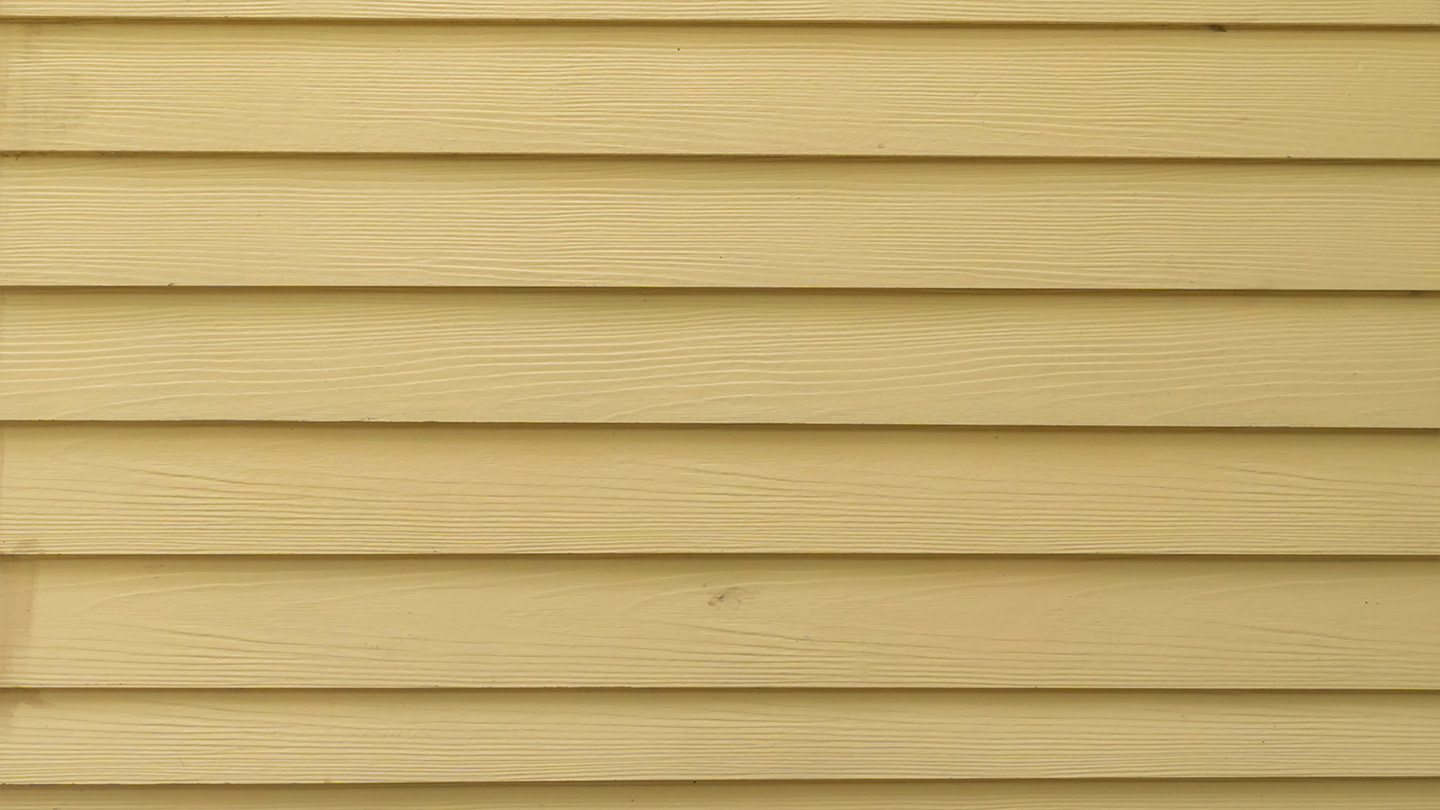 dirty yellow home siding